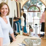 Woman at clothing store smiling